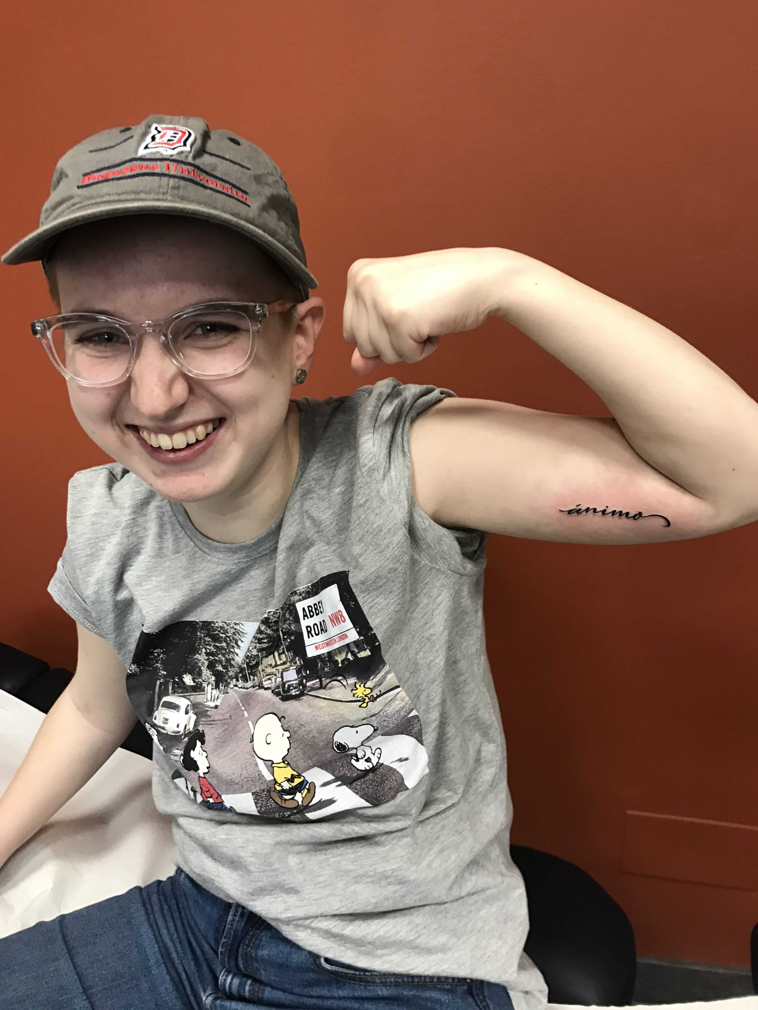 FCRH '19 Catherine Swindal gets 'Animo' tattooed on her arm at Tuff City (Courtesy of Catherine Swindal). 